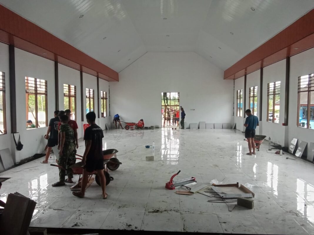Perkembangan Pekerjaan Pembangunan Lantai Gereja GKI Talitakum pada TMMD ke-125 Kodim 1705/Nabire