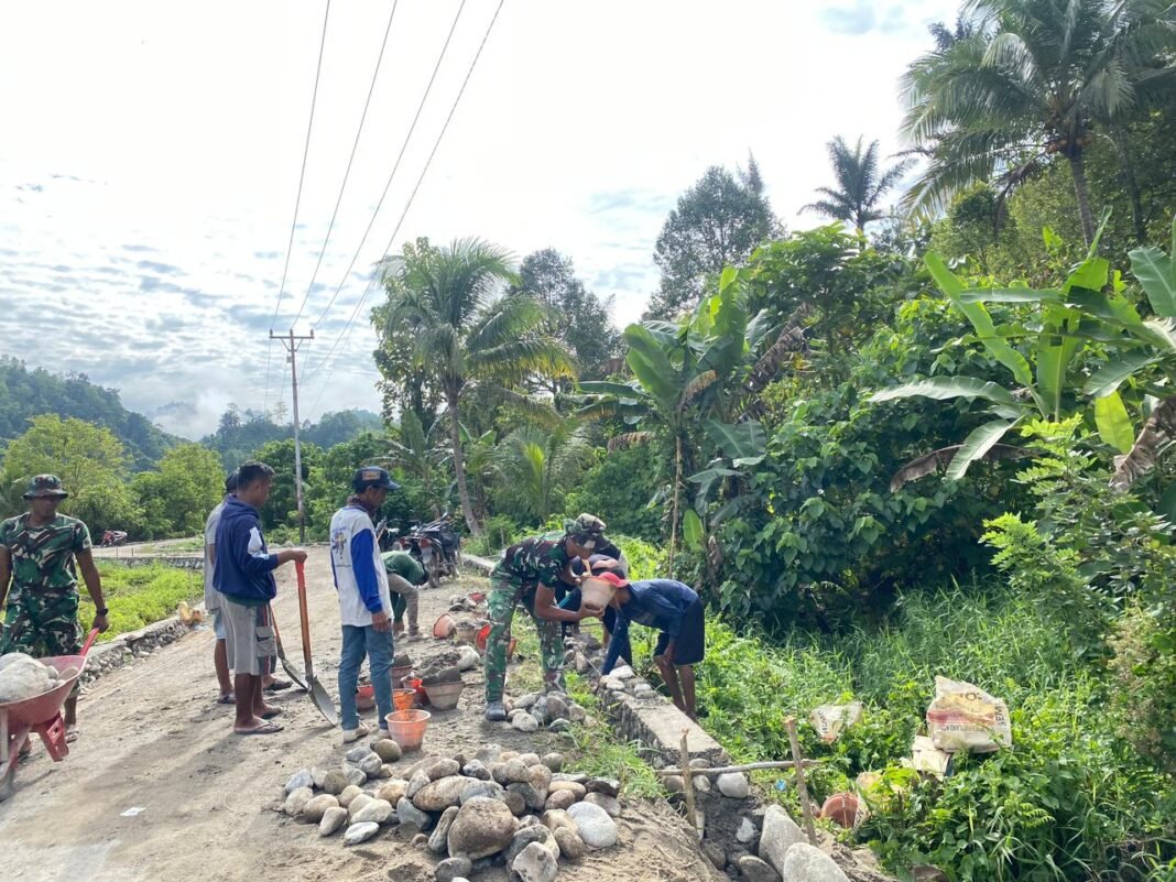Satgas TMMD ke-127 Kodim 1305/Buol Tolitoli Laksanakan Pengerasan Jalan dan Talud di Dusun Ogomolobu