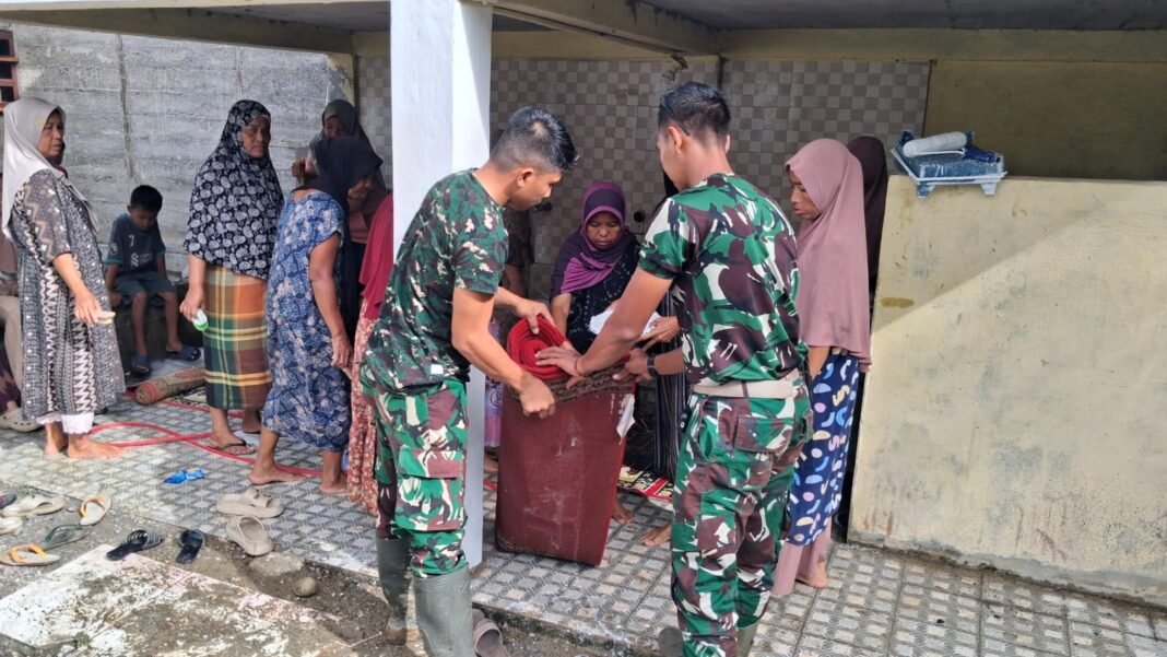 Satgas TMMD Jadikan Jumat Penuh Makna di Desa Lueng Jawa