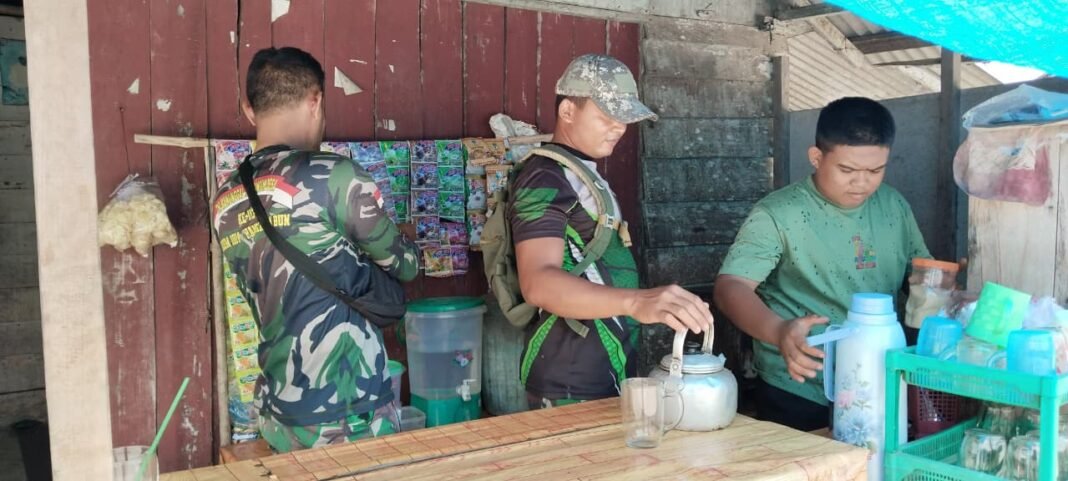 Keakraban Satgas TMMD dan Warga di Sungai Hijau