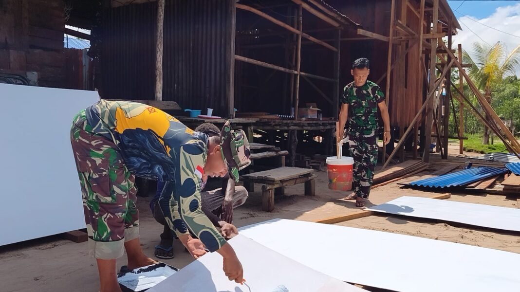 Satgas TMMD dan Warga: Pengecatan Plafon dalam Semangat Kebersamaan