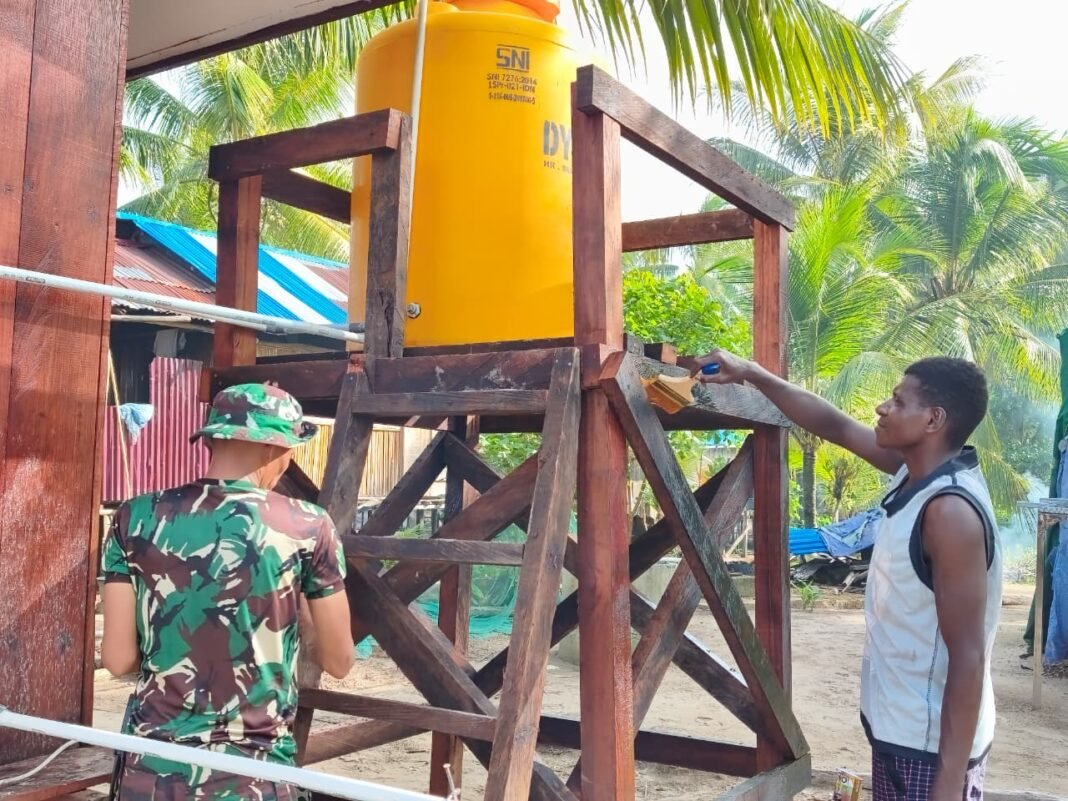 Finishing Pembangunan Sarana Air Bersih TMMD Melalui Pengecatan Profil Tank