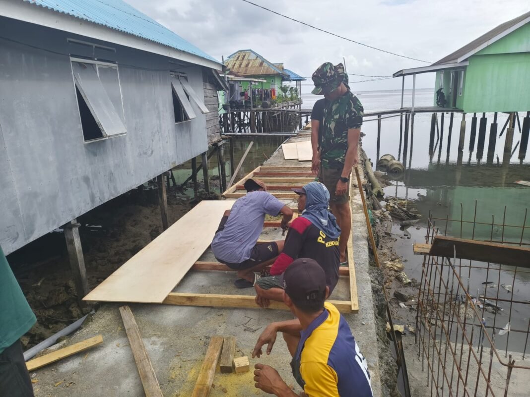 Kerja Sama Satgas TMMD dan Warga untuk Pemasangan Bak Air