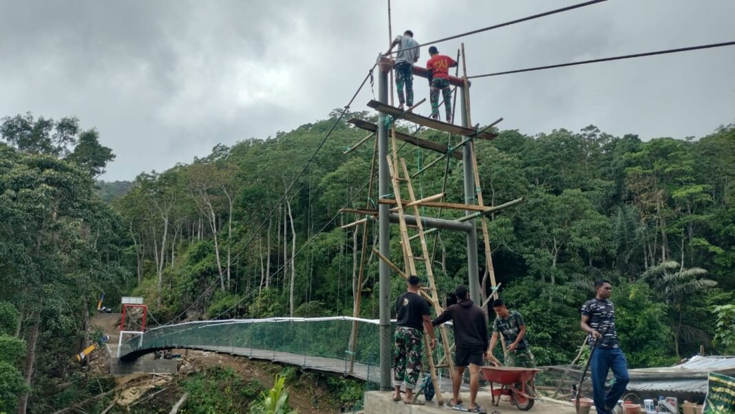 Satgas TMMD Ke-129 Lanjutkan Pengecatan Jembatan di Bone