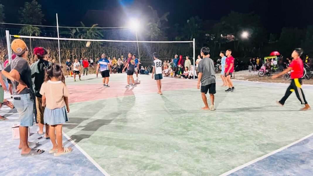 Lapangan Voli TMMD 129: Pusat Hiburan Malam yang Membangkitkan Semangat Warga Tlemang