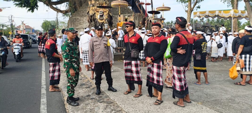 KOMITMEN BABINSA DAN PECALANG DALAM KEAMANAN NUNAS TARU